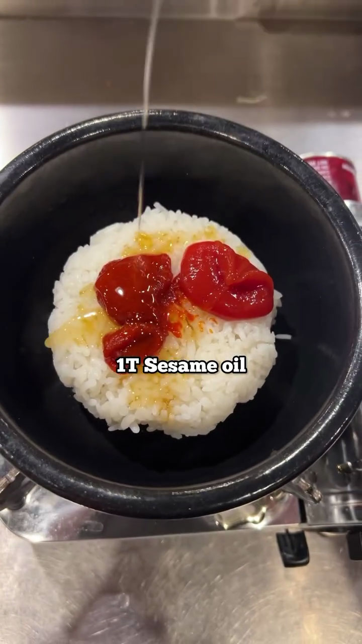 Season the rice with gochujang, ketchup, and sesame oil