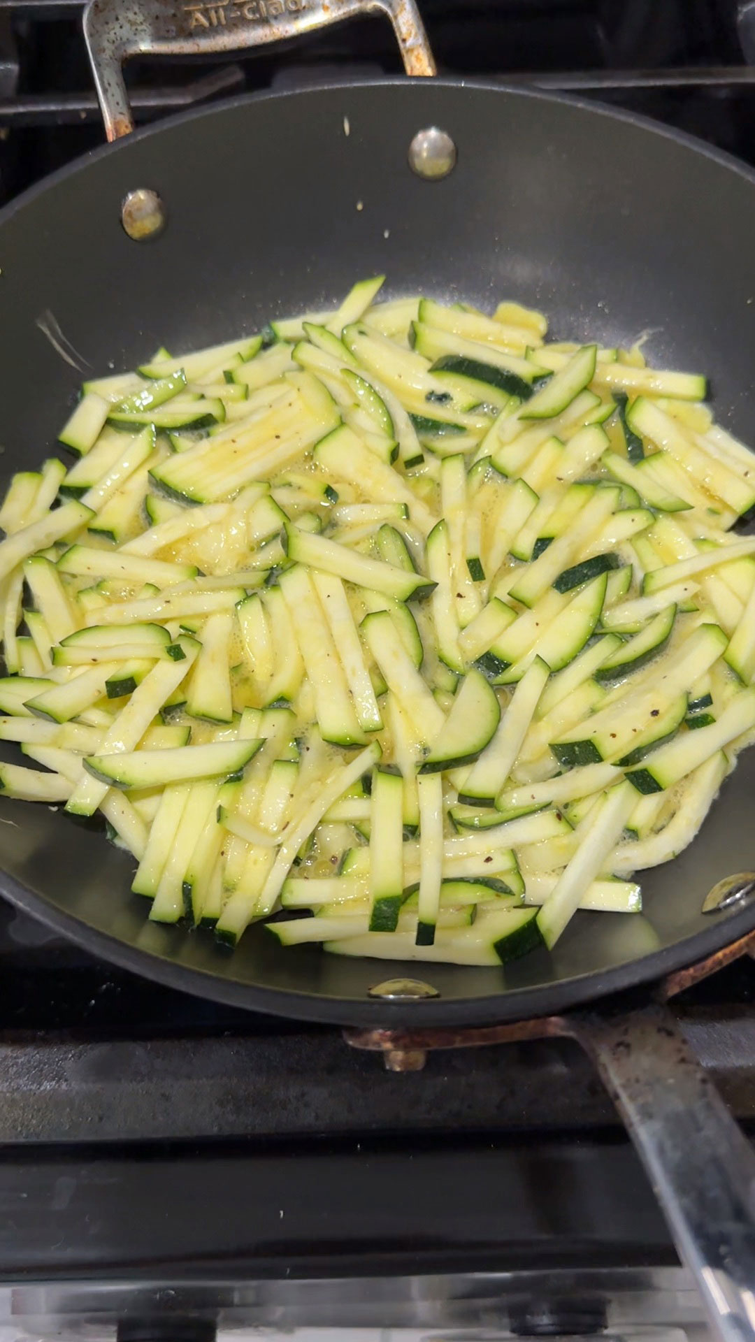 Spread out the battered zucchini in a heated pan