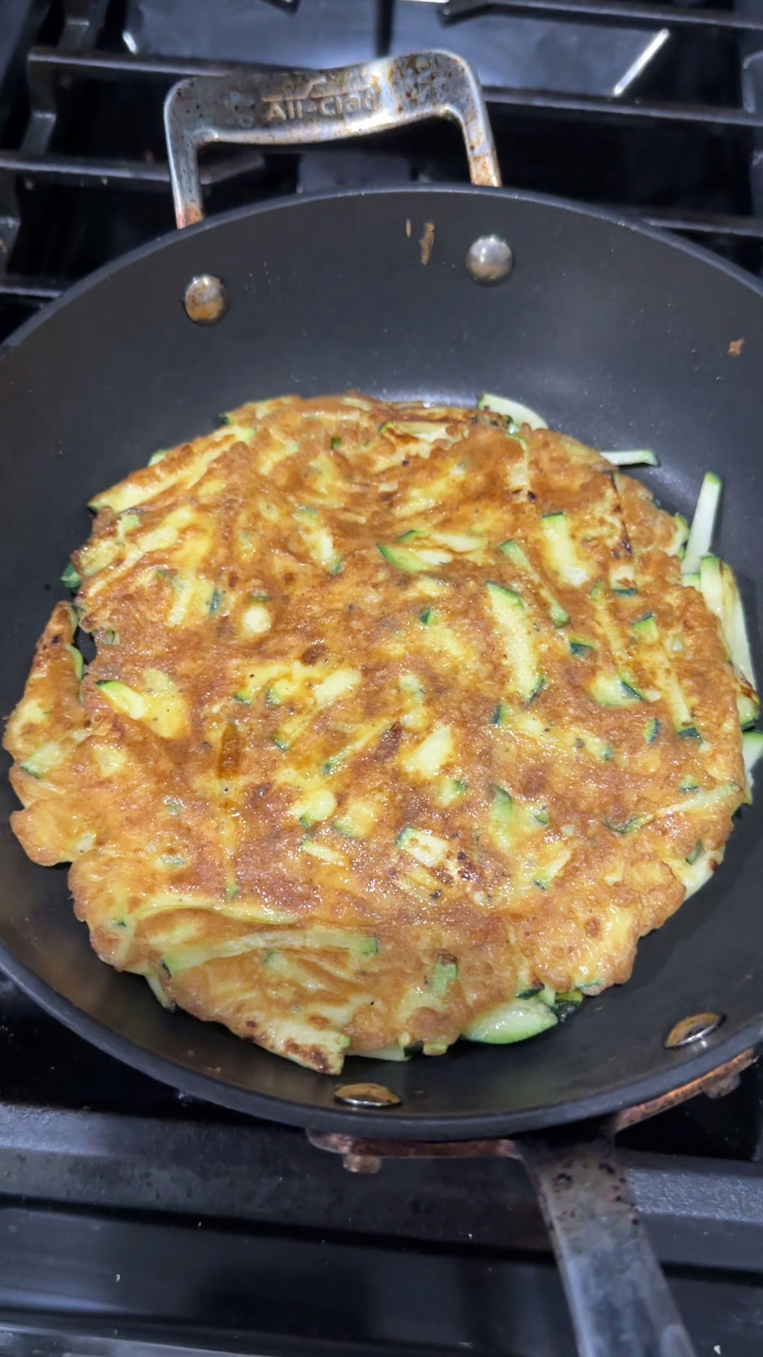 Pan fry the zucchini pancake for 5 minutes on each side 