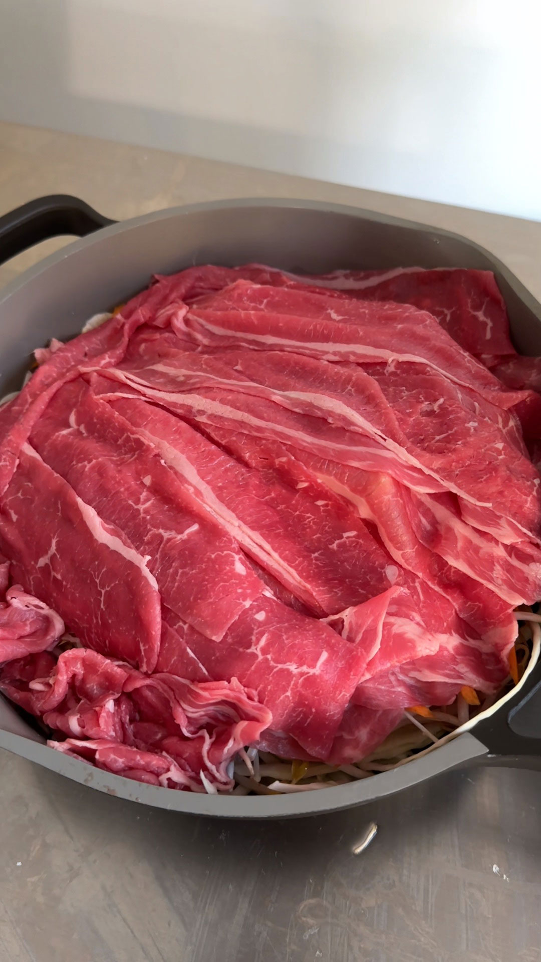 Layer beef on top of the vegetables