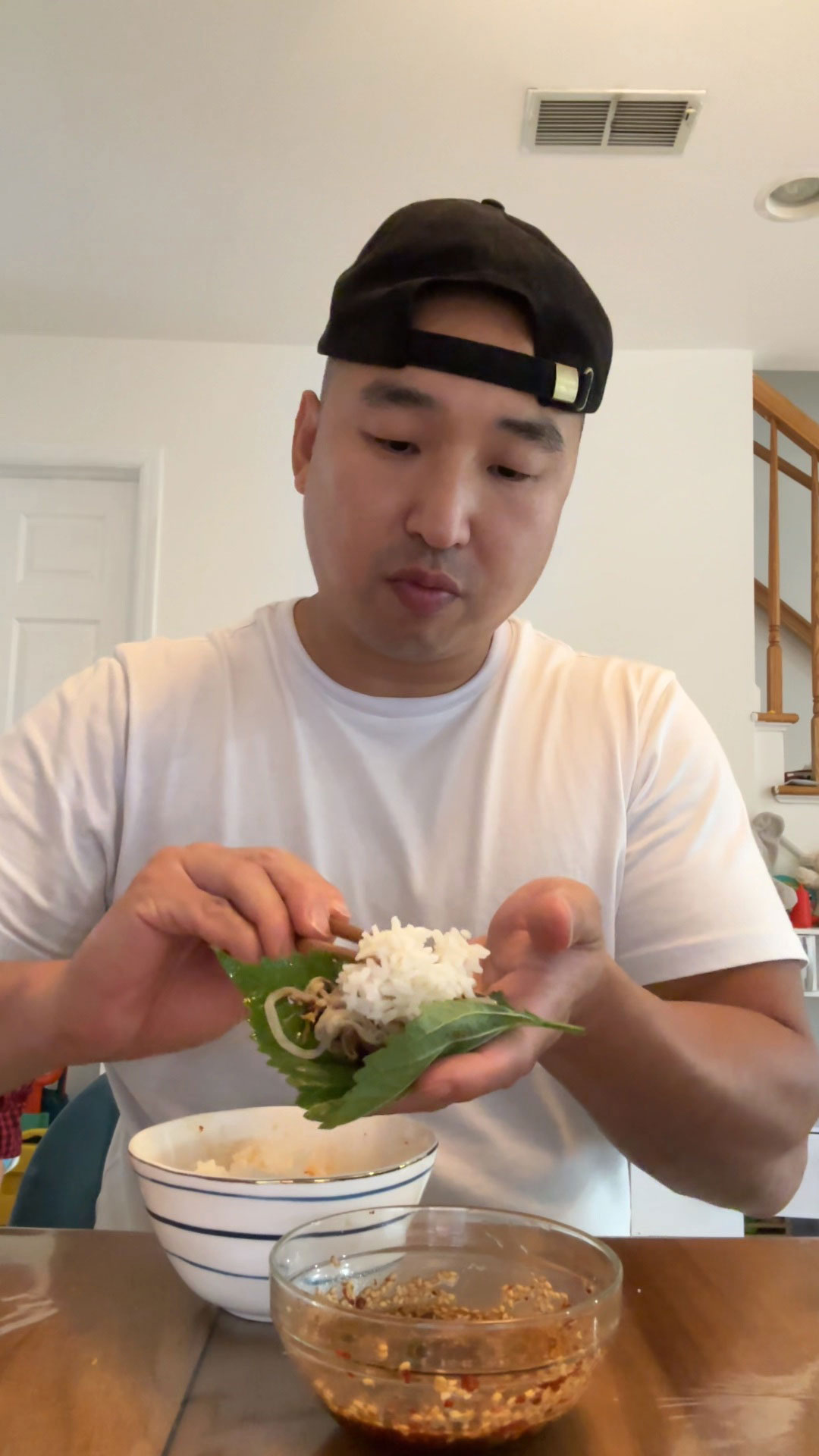 Wrap the beef and vegetables with perilla leaves