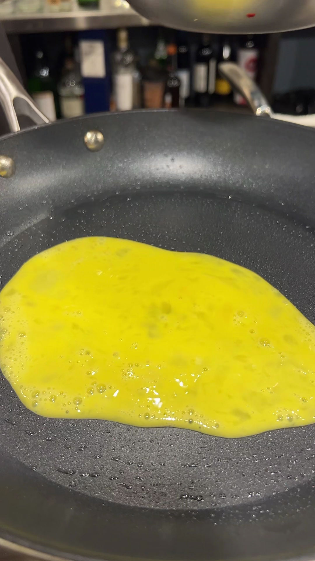 Place scrambled egg on a heated pan