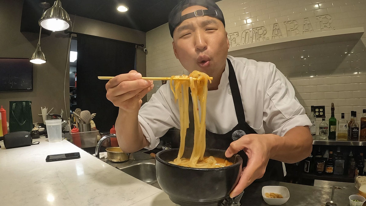 Chef Chris Cho making Kimchi Udon Soup