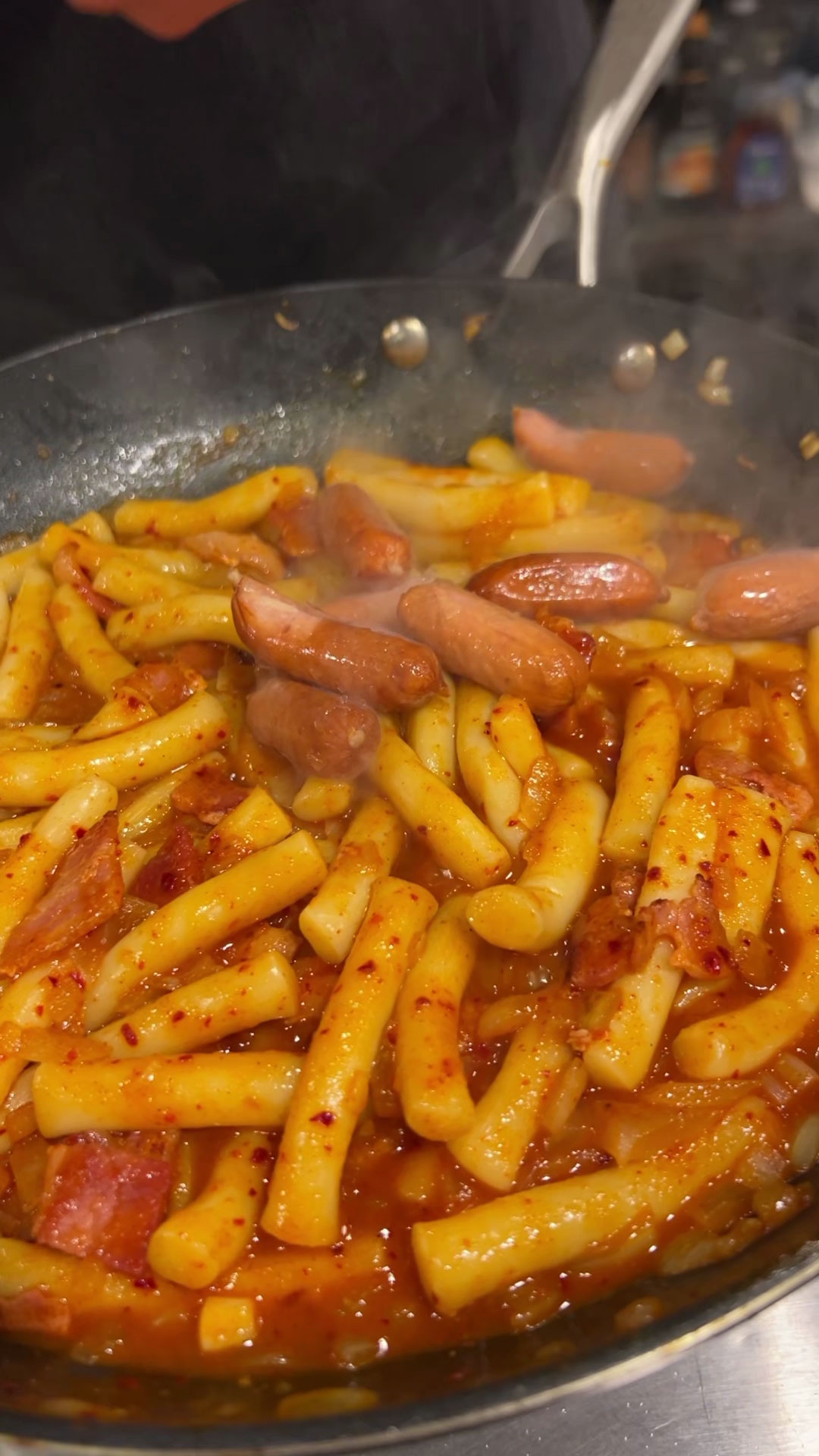 Mix thoroughly and add sausage to the tteokbokki