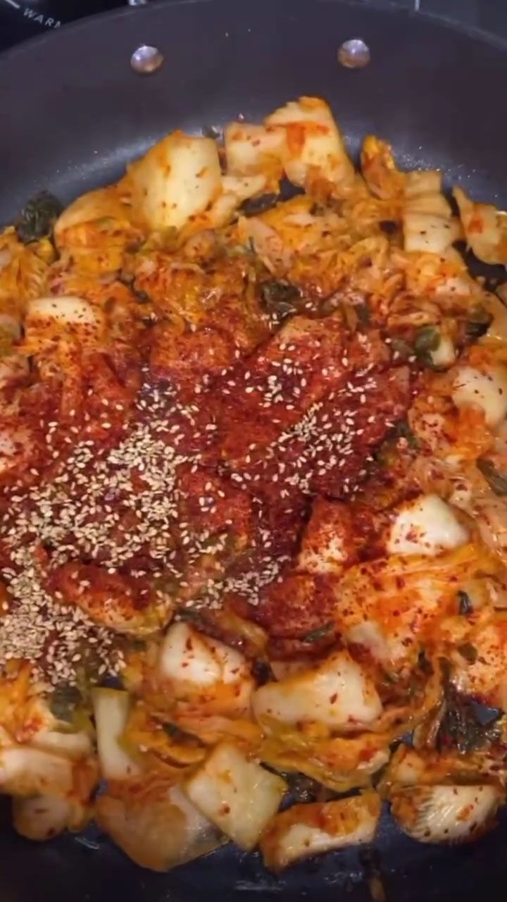 Season and stir fry the kimchi