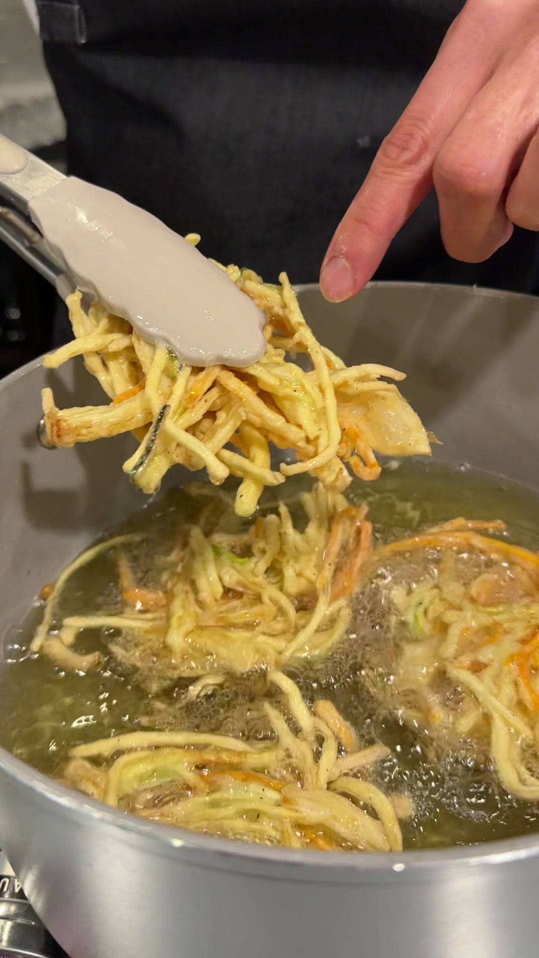 Fry the vegetable tempura until golden brown