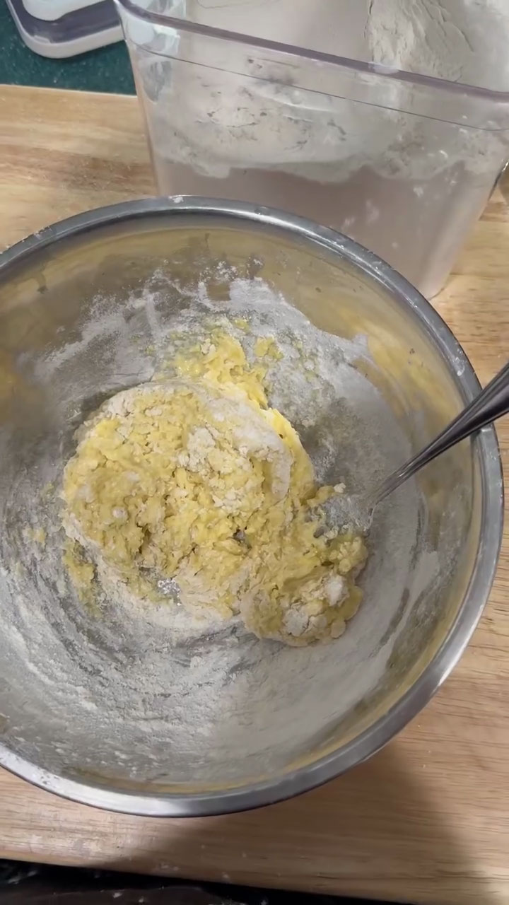 Mix to create a rough and sticky dough