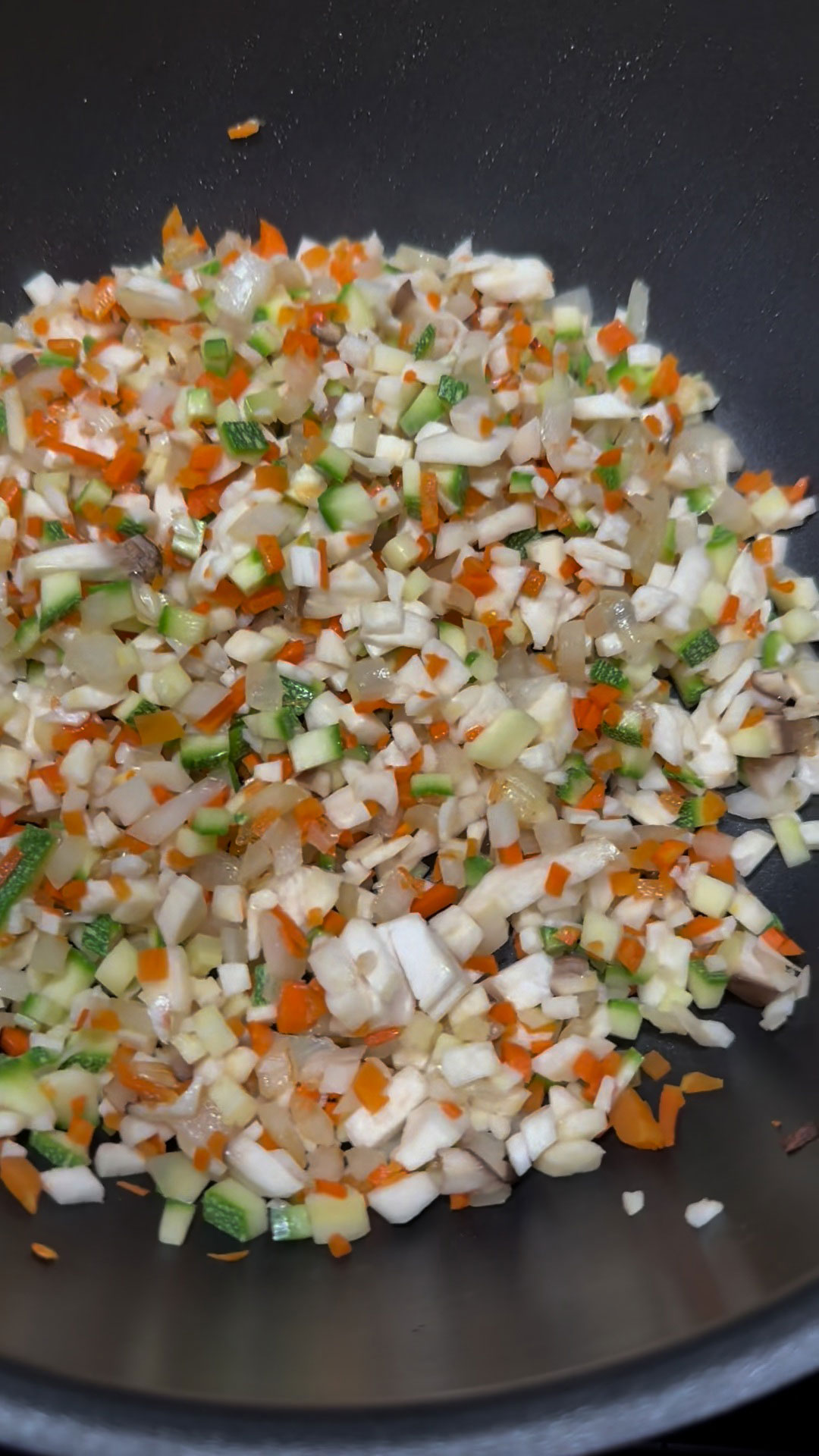 Saute the onion, carrots, and zucchini