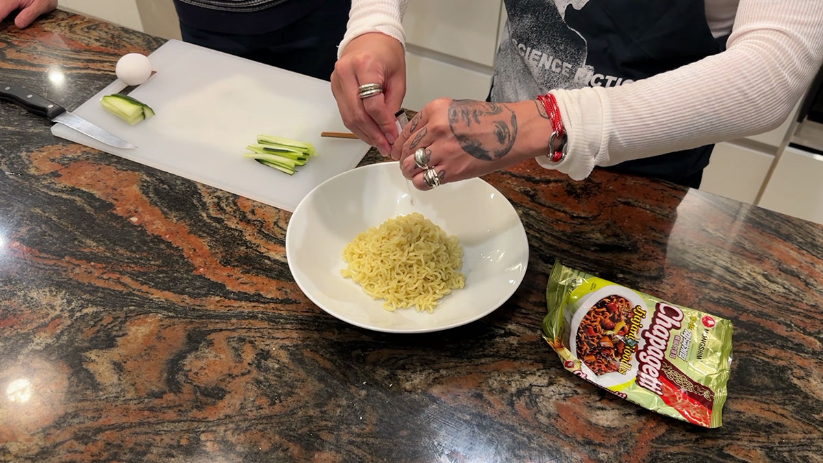 Remove the noodles from the pot and add oil packet 