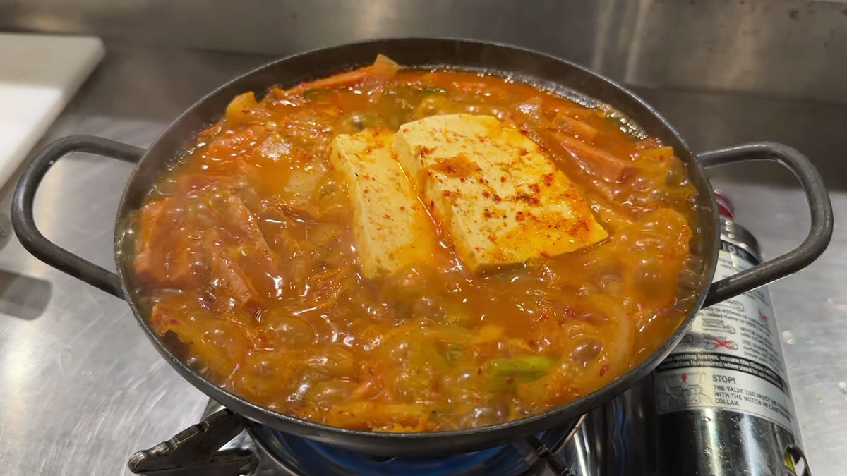 Add tofu and leave kimchi jjigae to boil