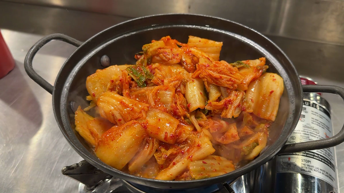 Cook the spam and kimchi in sesame oil