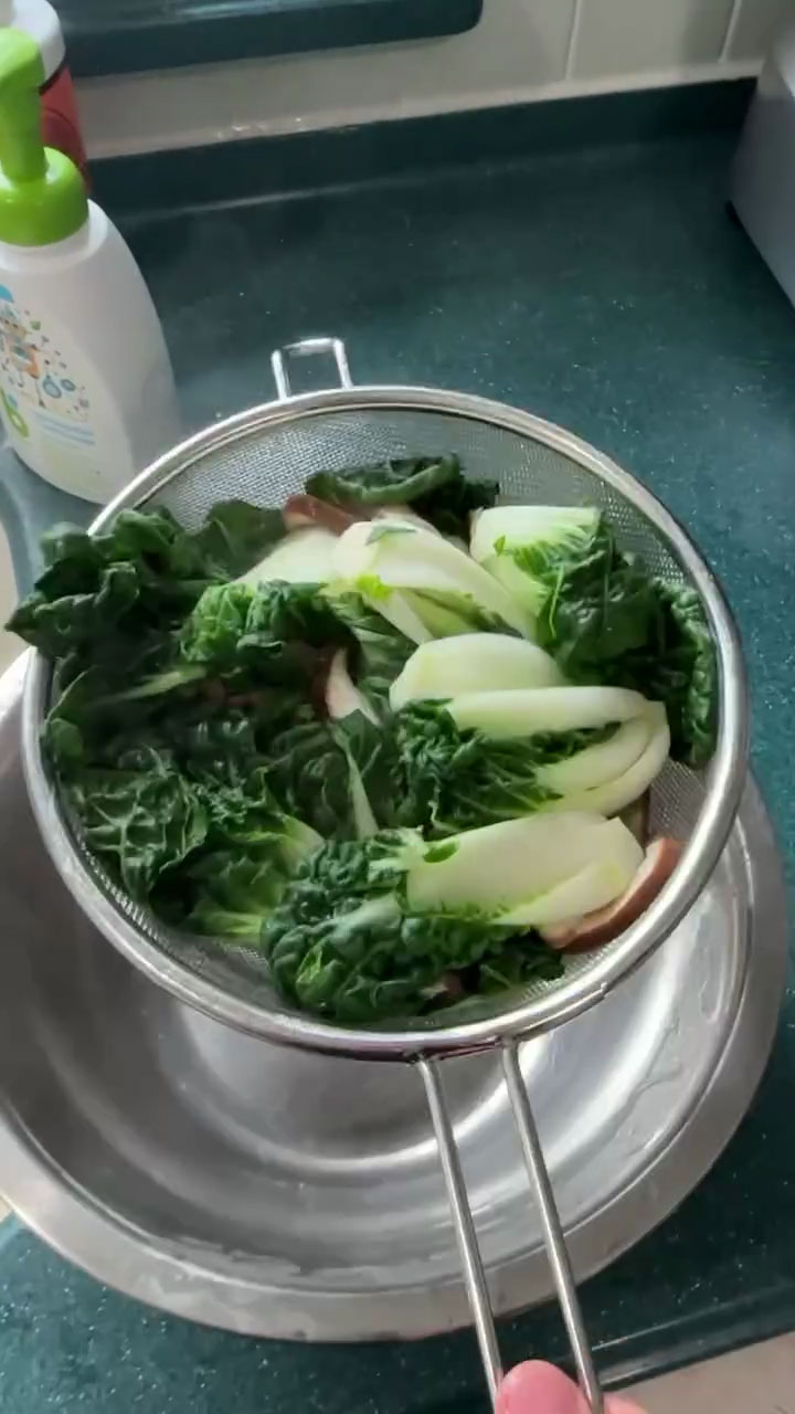 Drain the blanched bok choy 