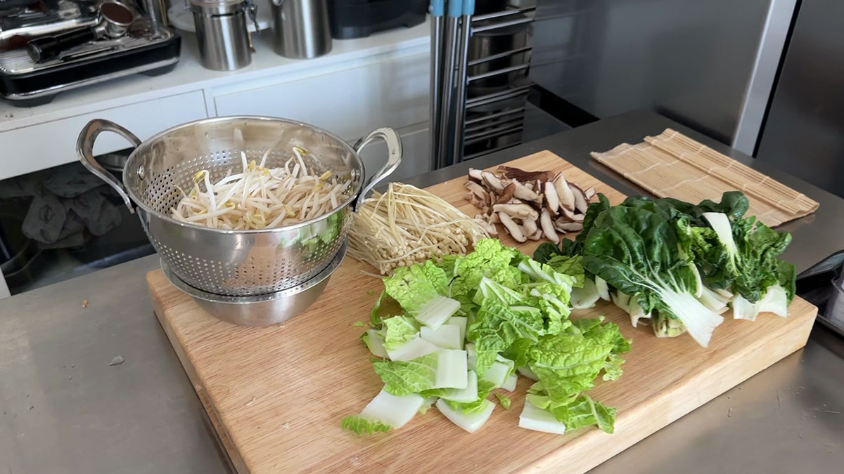 Bean sprouts, enoki mushrooms, shiitake mushrooms, napa cabbage, and bok choy