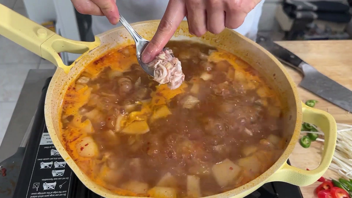 Season soup with gochujang, salted shrimp, fish sauce, and hondashi