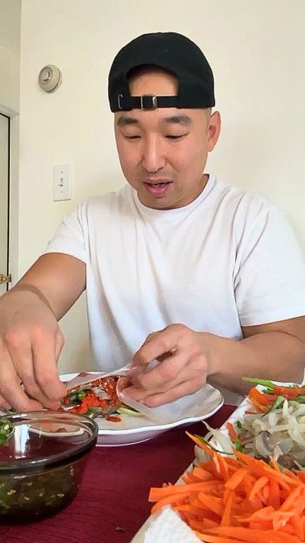 Fold side then the bottom of the rice paper 