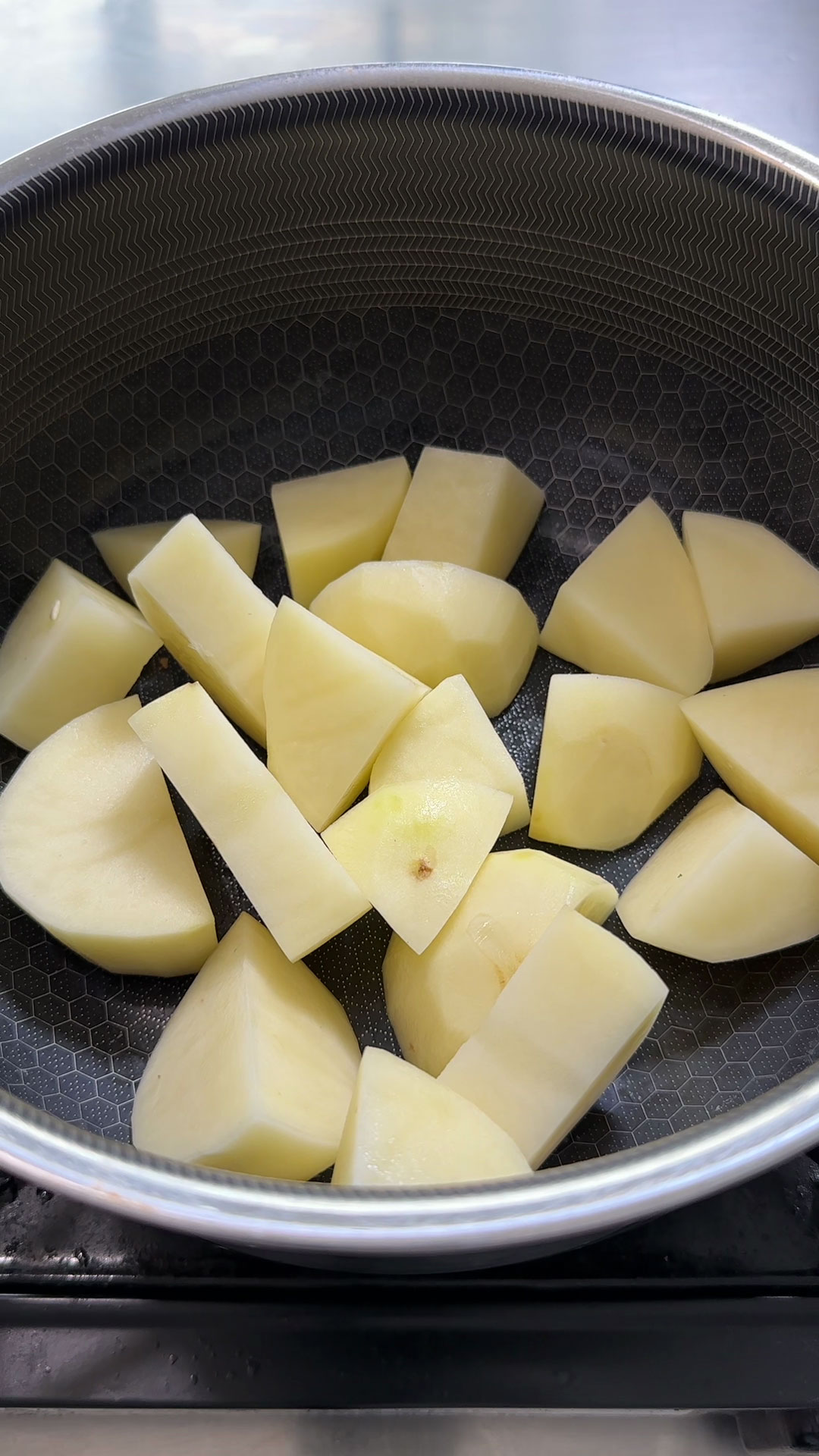 Chopped potatoes inside a pot