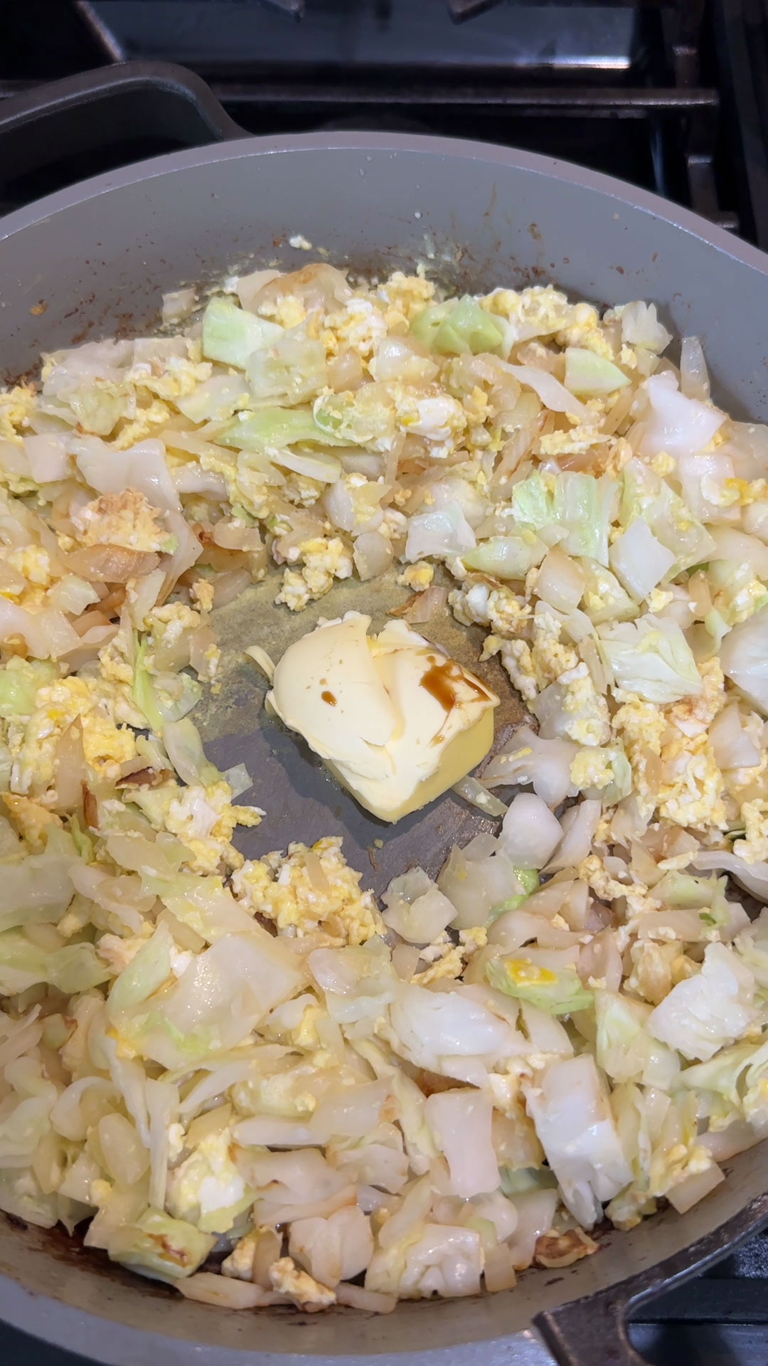 Sauteing cabbage and egg with butter