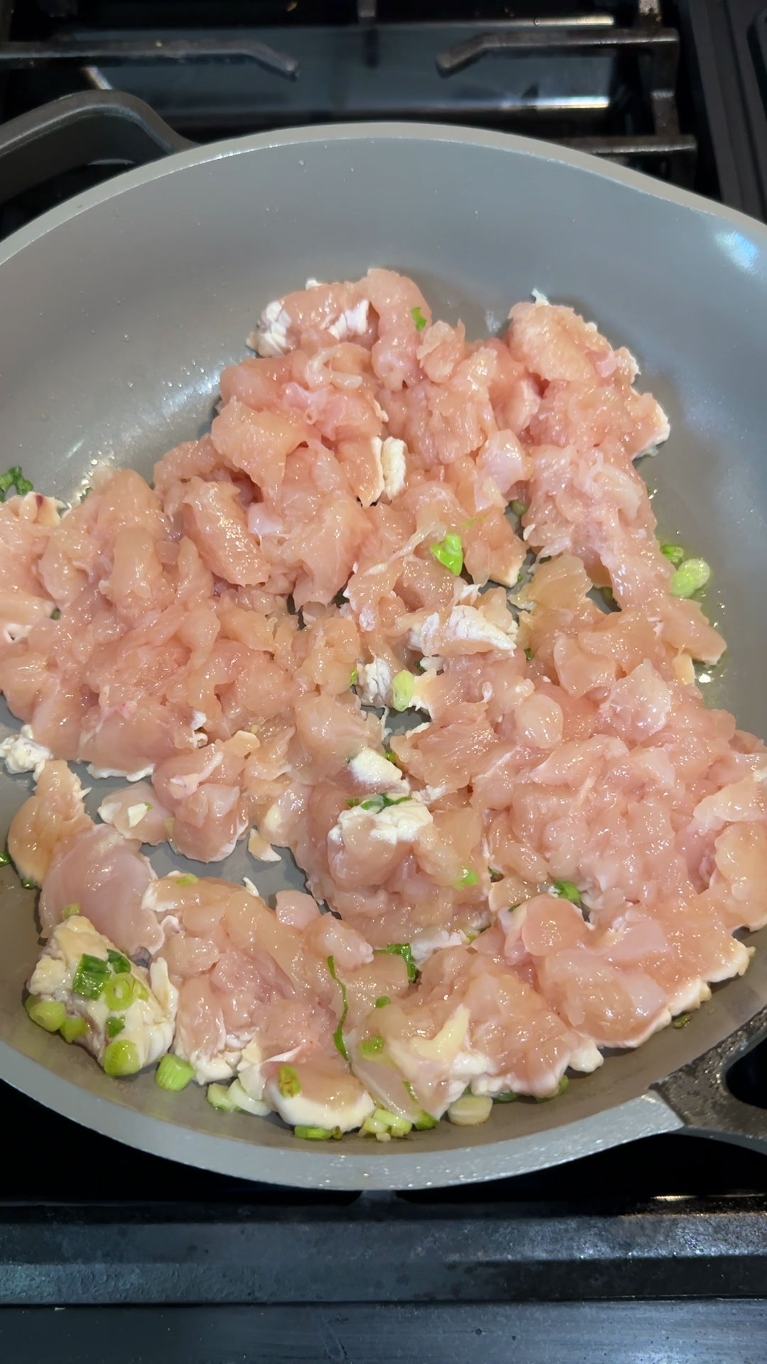 Saute the chicken with the scallions 