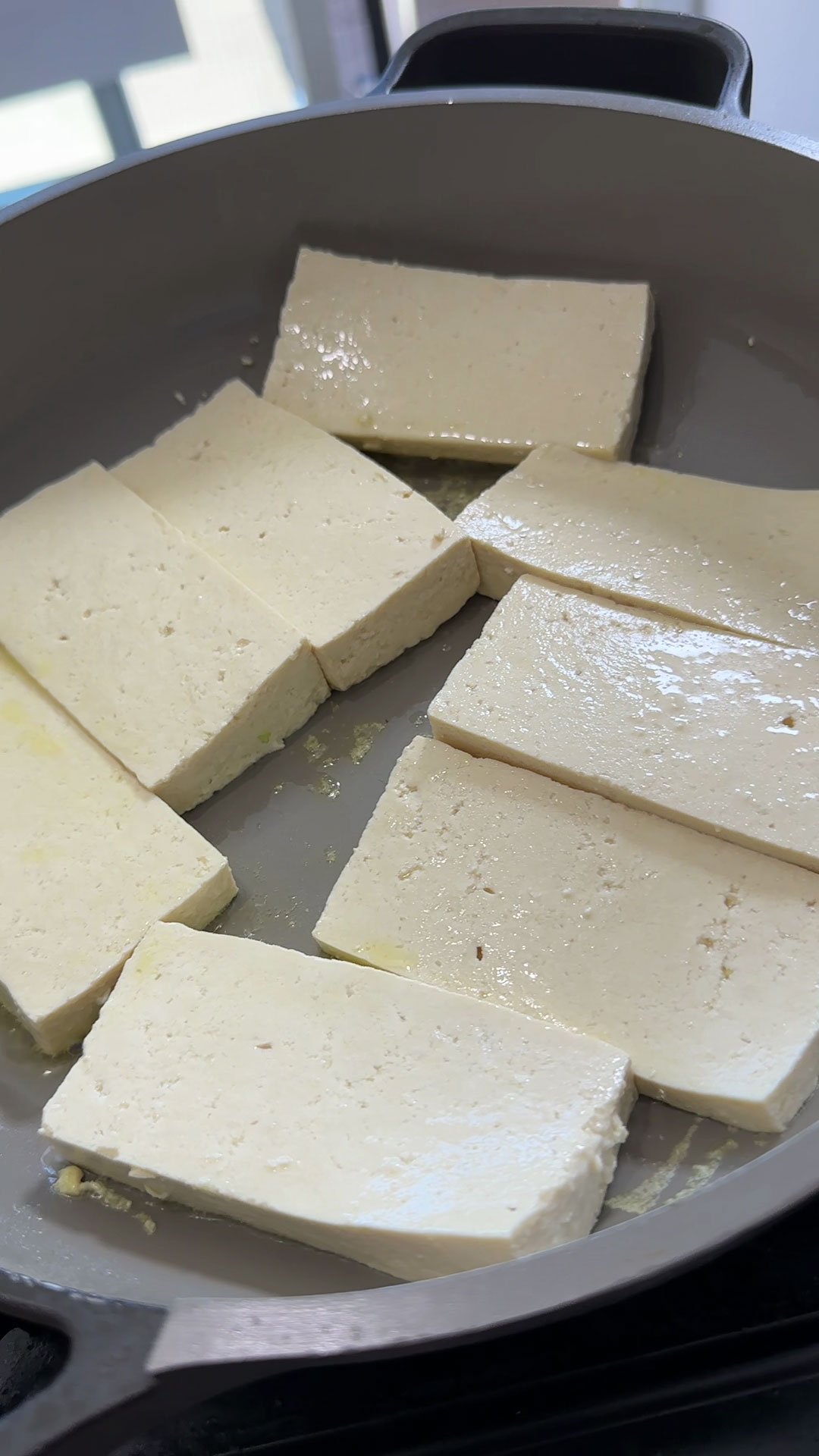 Pan frying the tofu 