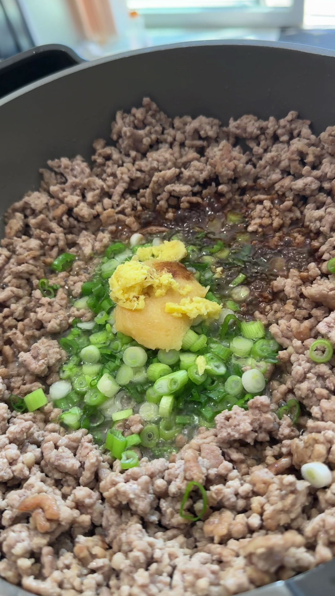 Add scallions, garlic, ginger, and soy sauce 