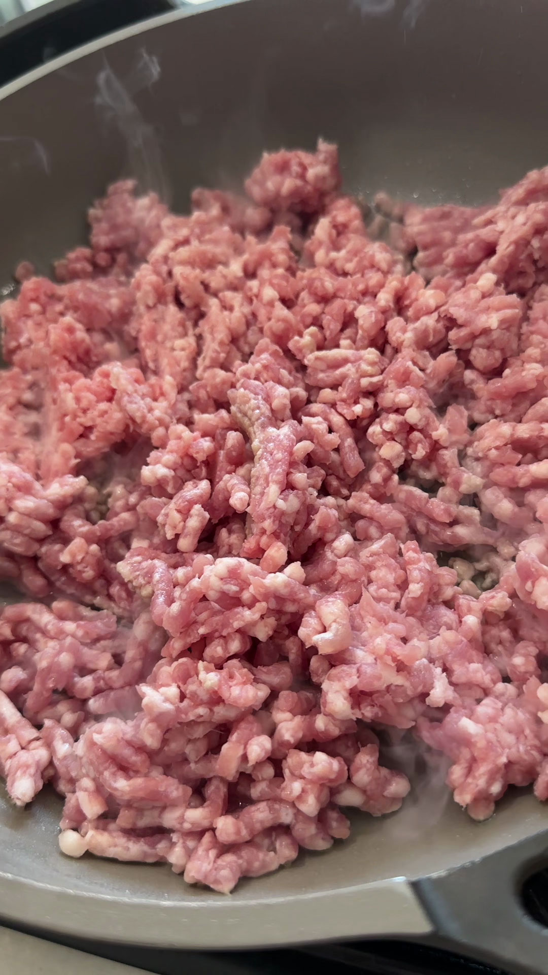 Spread out the minced pork over the pan