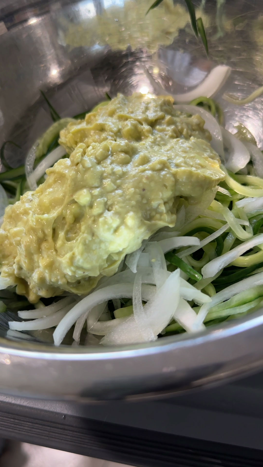 Combine cucumber, onion, and sauce to make Cucumber Noodles 