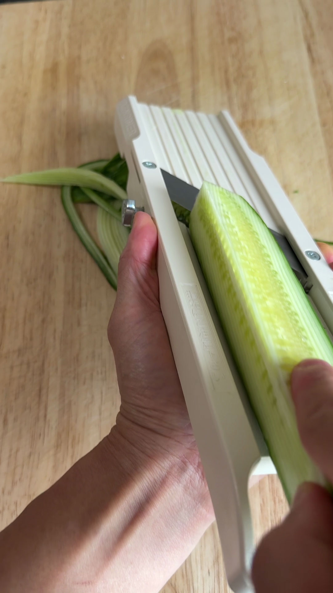 Slice the cucumber with mandolin
