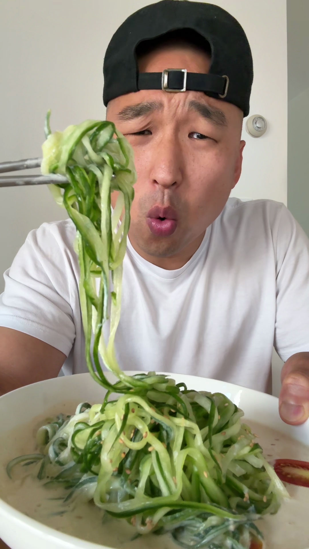 Chef Chris Cho making cucumber noodles with soy milk soup 