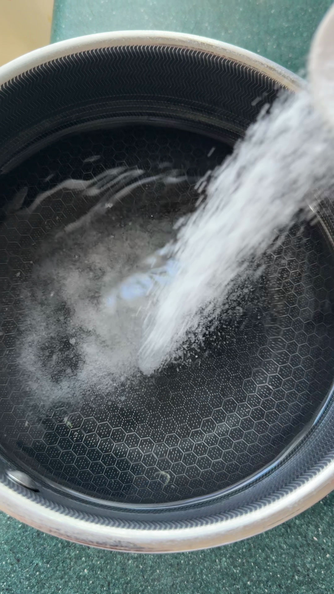Add salt to the water to make poaching liquid 