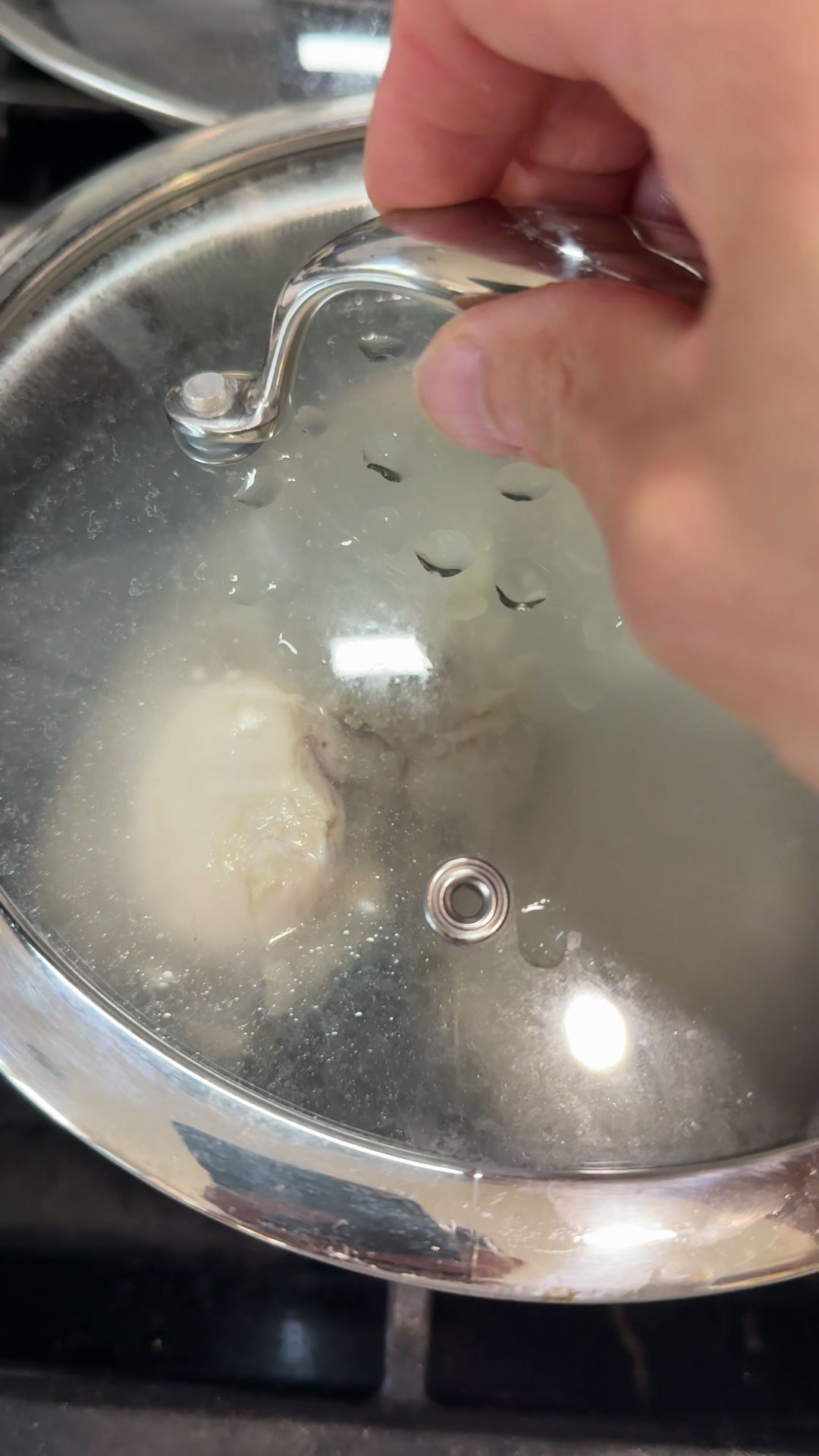 Cover the pot to poach the chicken thoroughly