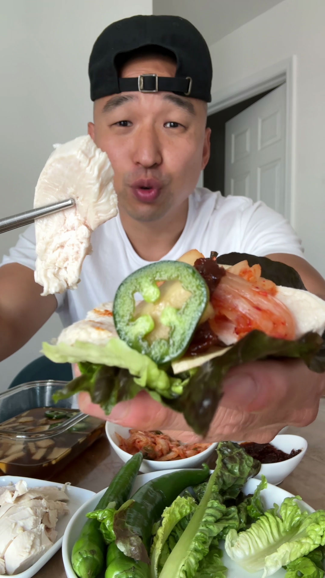 Chef Chris Cho making poached chicken