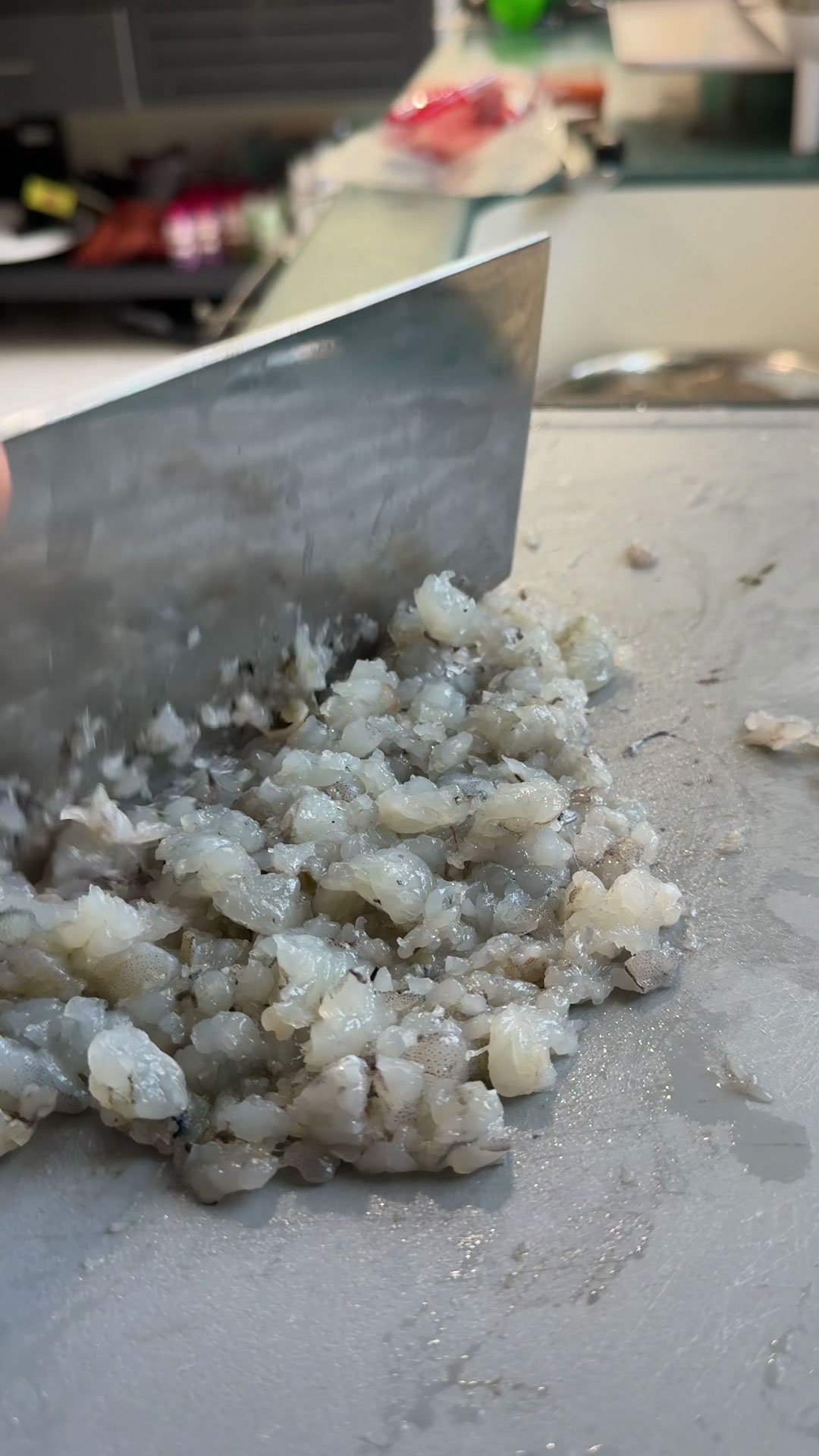 Chopping shrimp into chunks