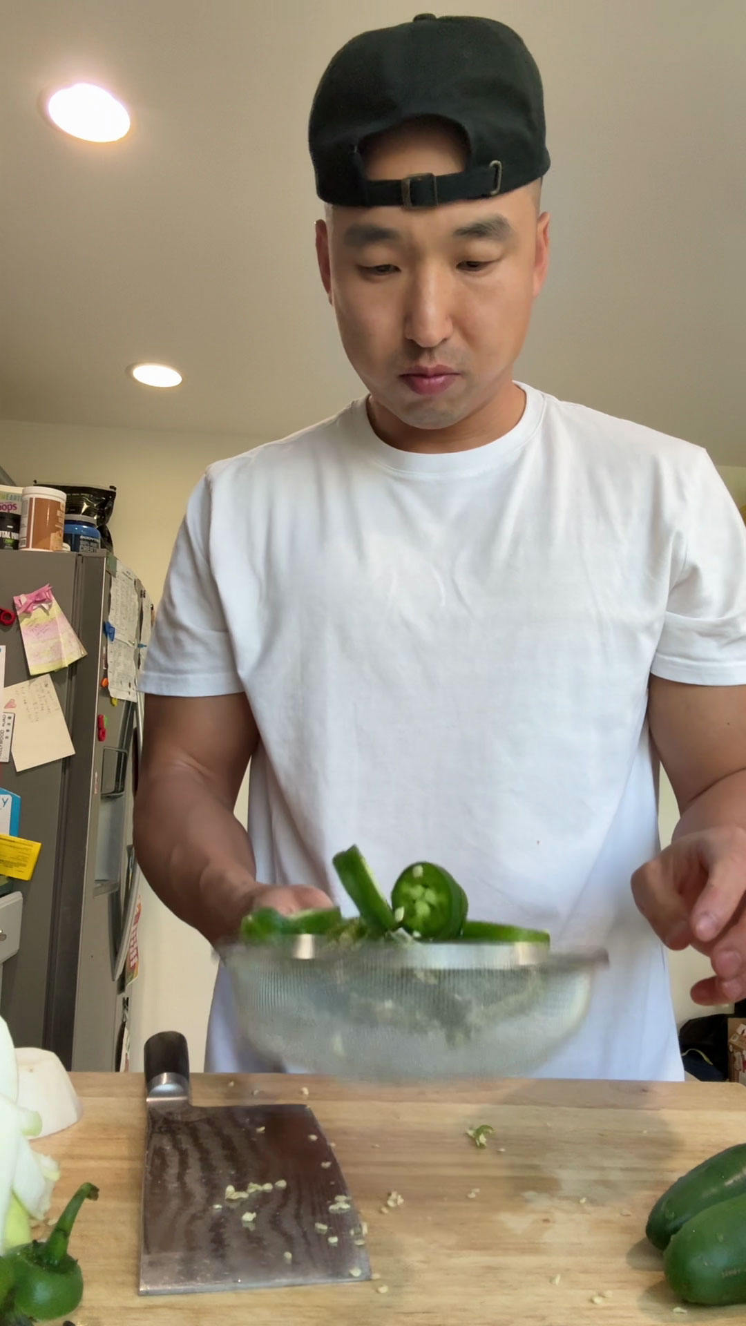 Place the peppers in a strainer and shake to remove seeds